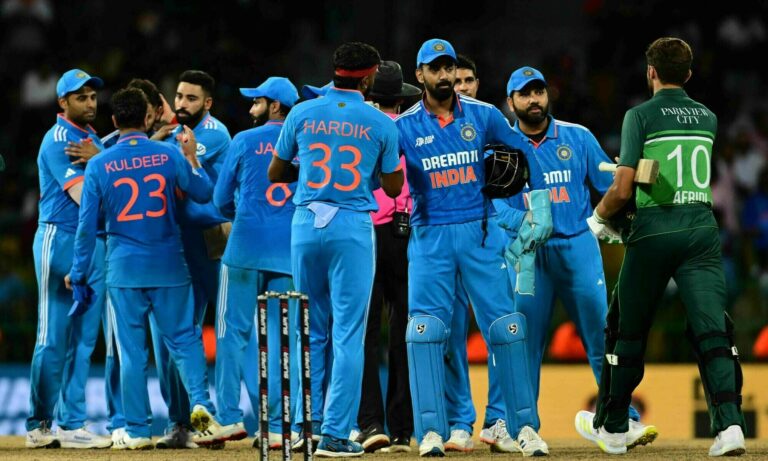 Indian cricket team celebrating a wicket