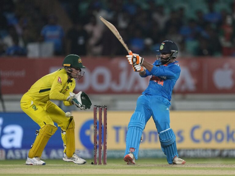 Indian batter playing a shot during a cricket match